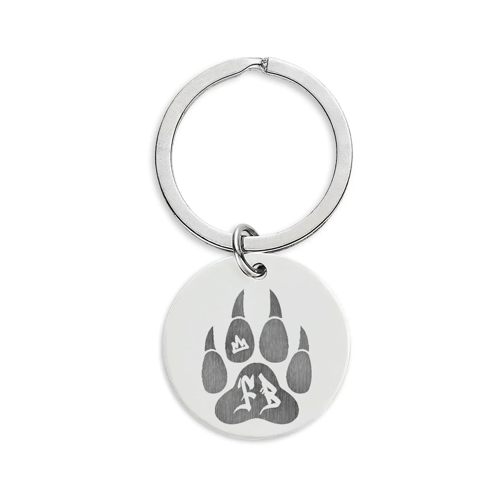 Silver keychain featuring a paw print design on a circular tag, perfect for pet lovers.