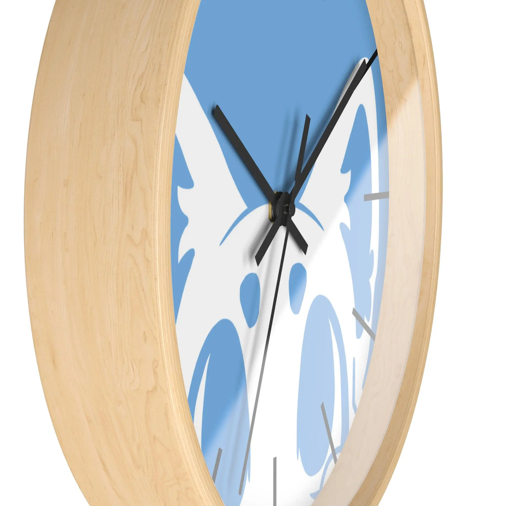 Stylish wooden clock with blue background and black hands, featuring a unique animal design.