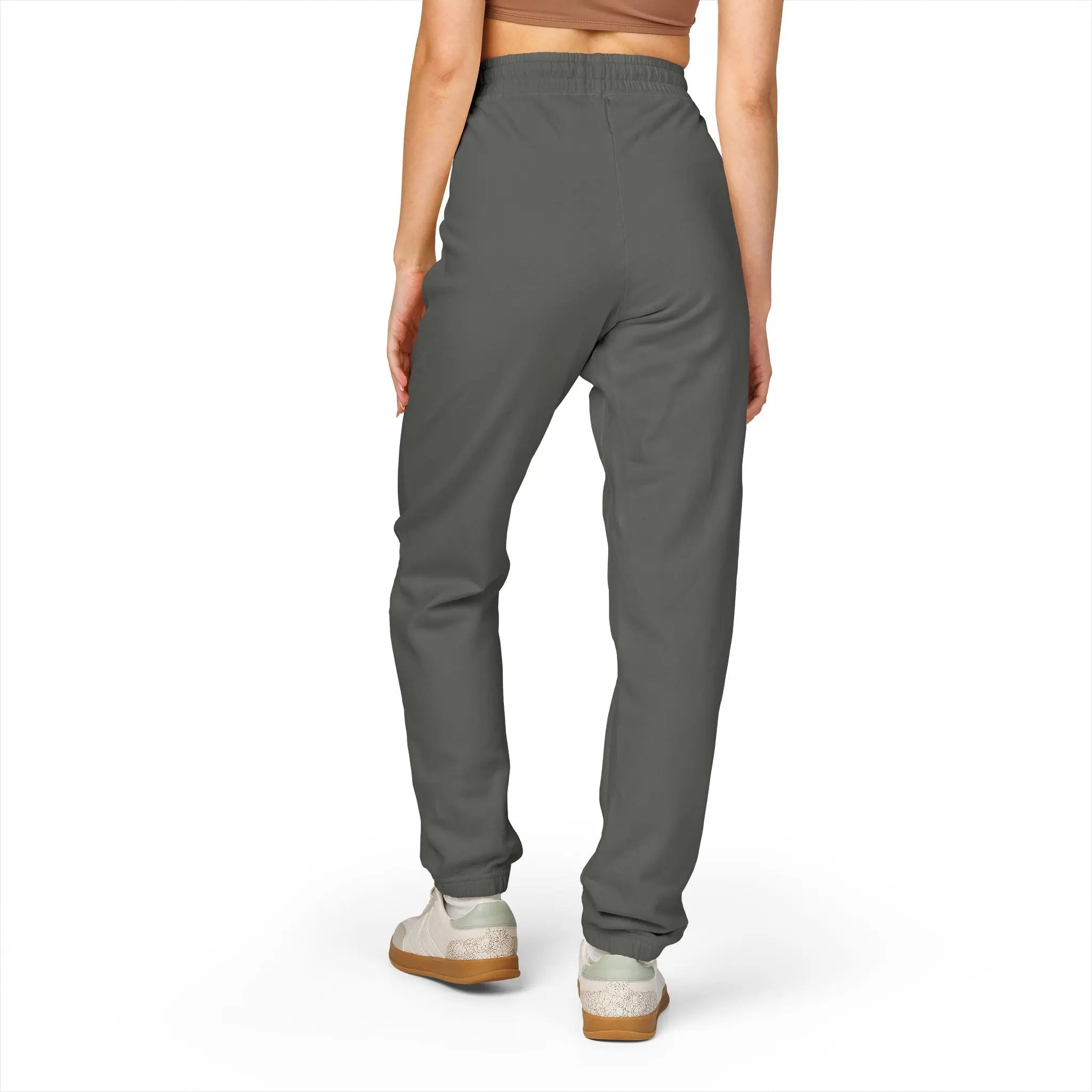 Women's gray jogger pants made from soft material, featuring an elastic waistband for comfort and style.