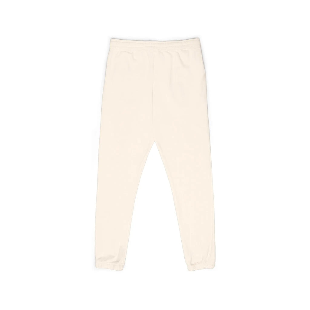 Soft cream cotton jogger pants with elastic waistband and cuffed ankles for comfort and style.