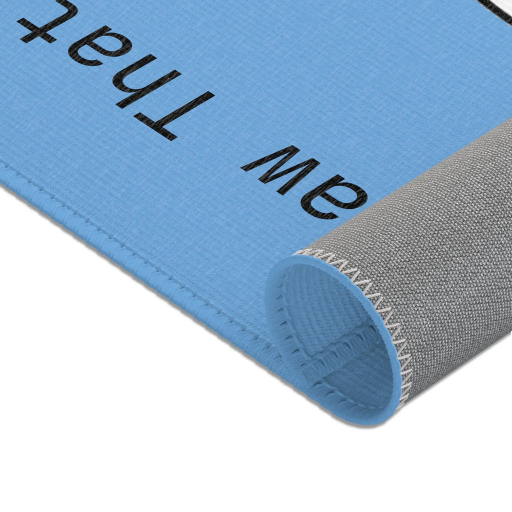 Blue textured mat with a gray edge, perfect for home decor and comfort.