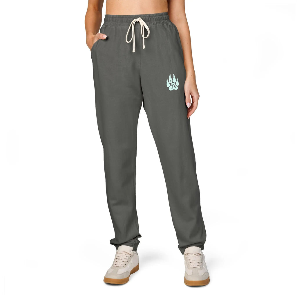 Women's gray jogger pants with elastic waistband and side pockets, featuring a stylish graphic print.