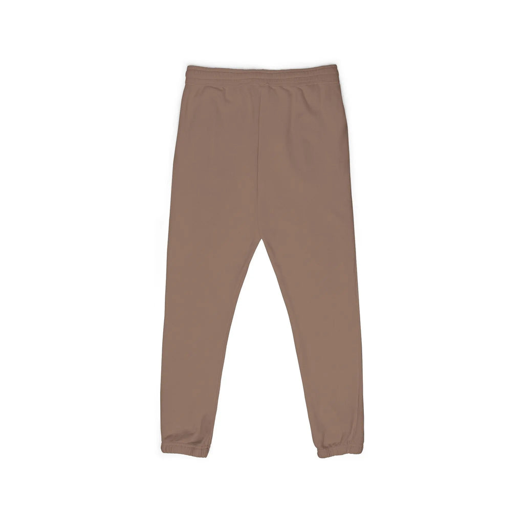 Brown jogger pants made from soft material, featuring an elastic waistband and cuffed hems for comfort.