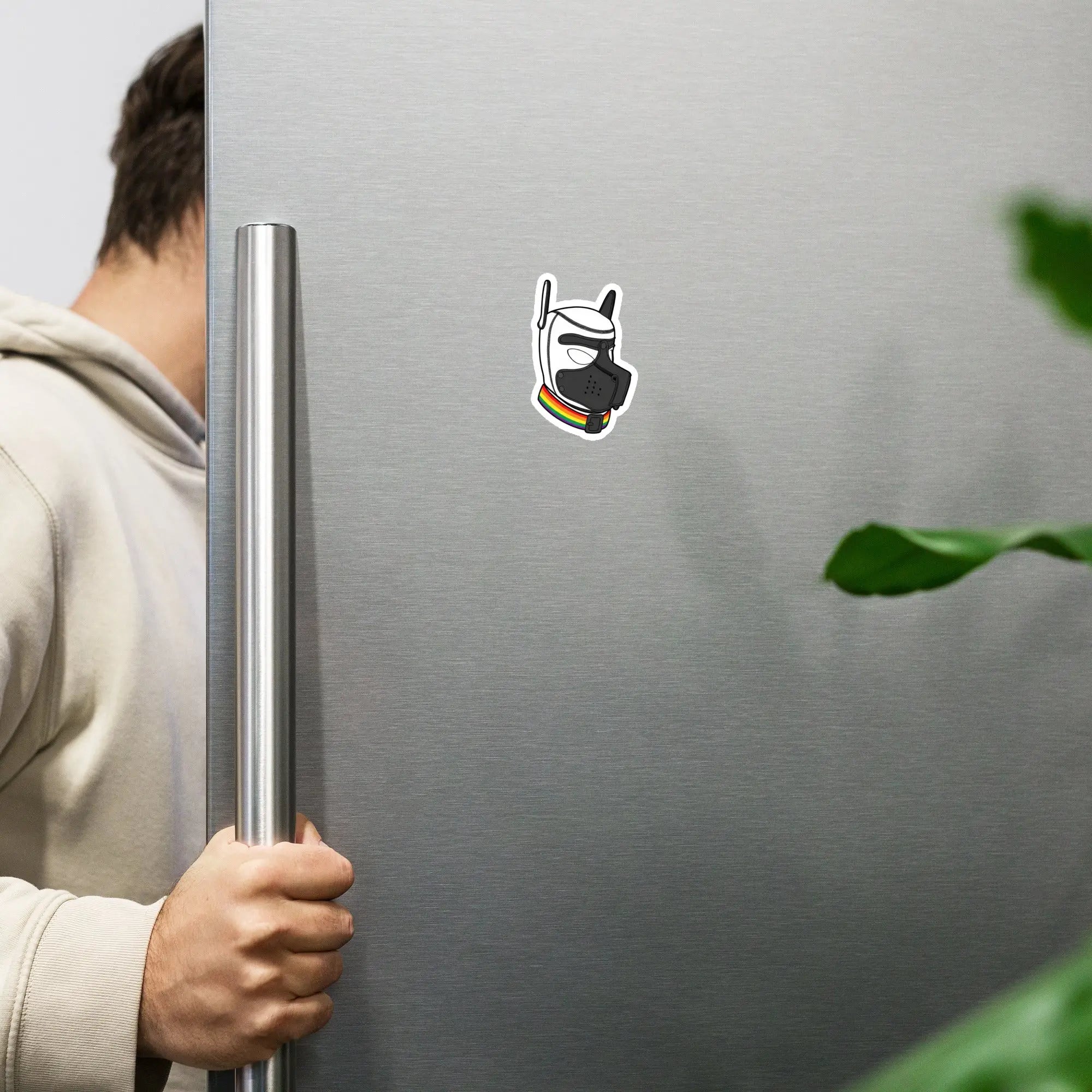 Fun vinyl sticker of a character in a mask on a stainless steel refrigerator.