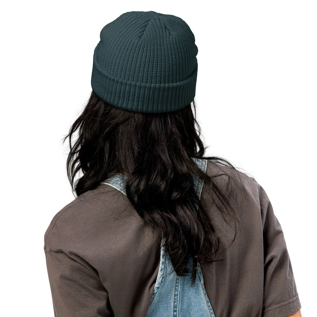 Dark teal knitted beanie hat, perfect for winter wear, stylish and warm accessory.