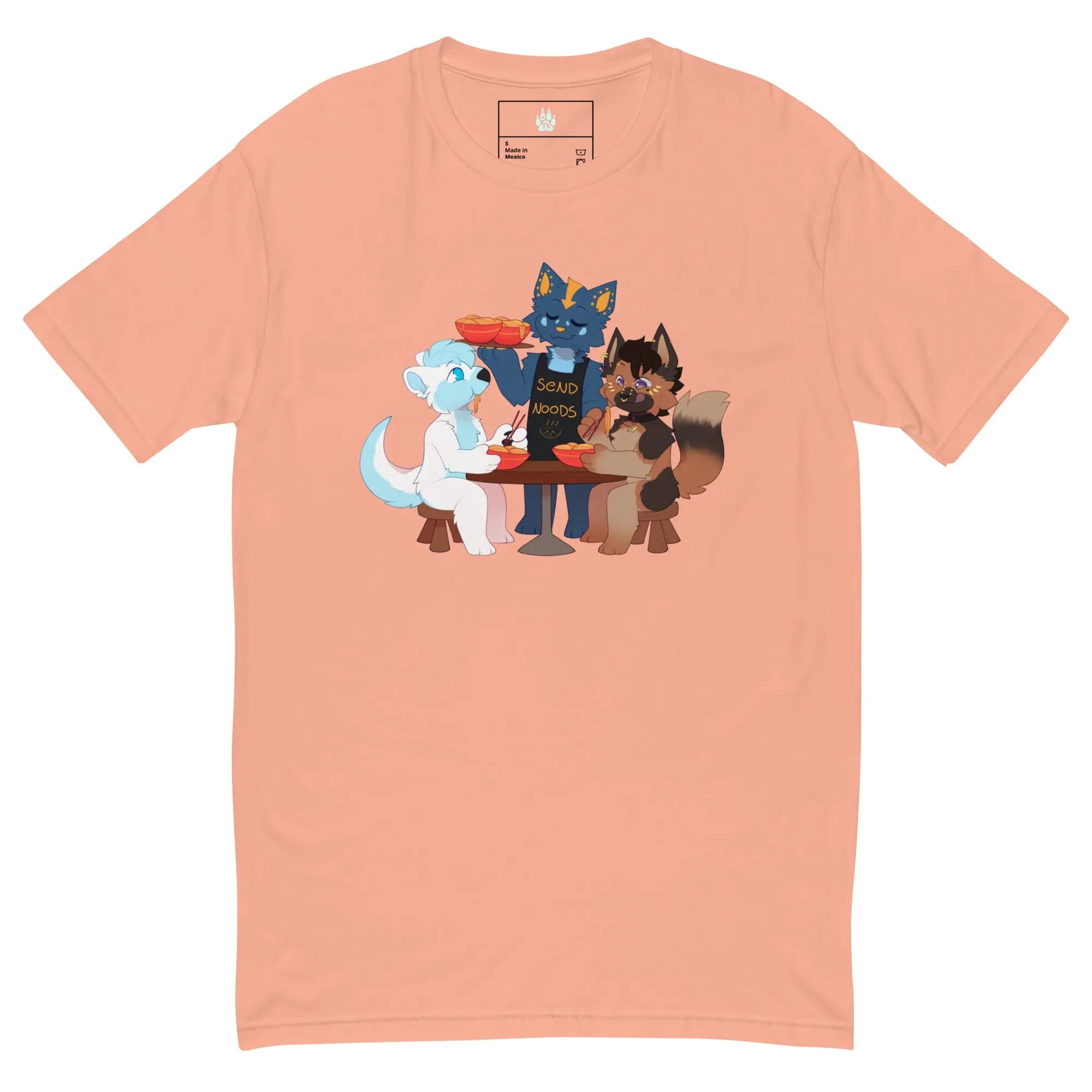 Light peach t-shirt featuring cute illustrated fox characters at a table with noodles.