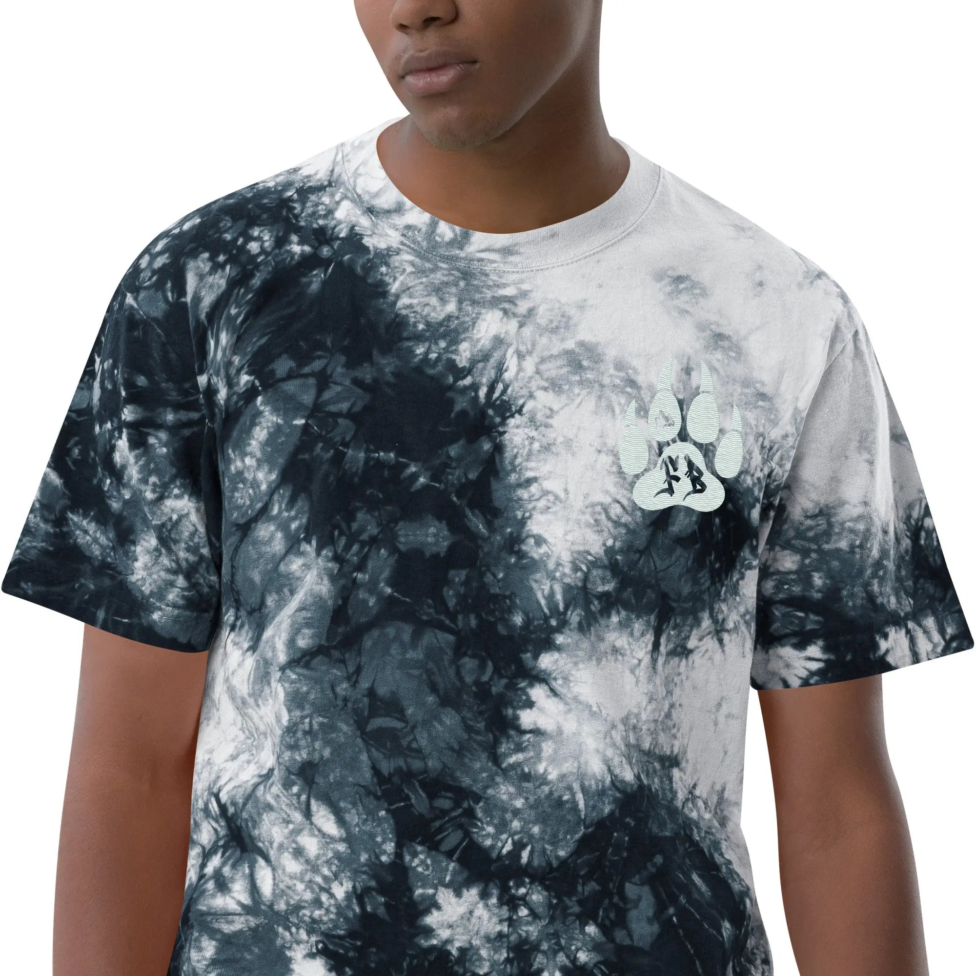 Men's black and white tie-dye t-shirt with a paw print design, made from soft cotton material.