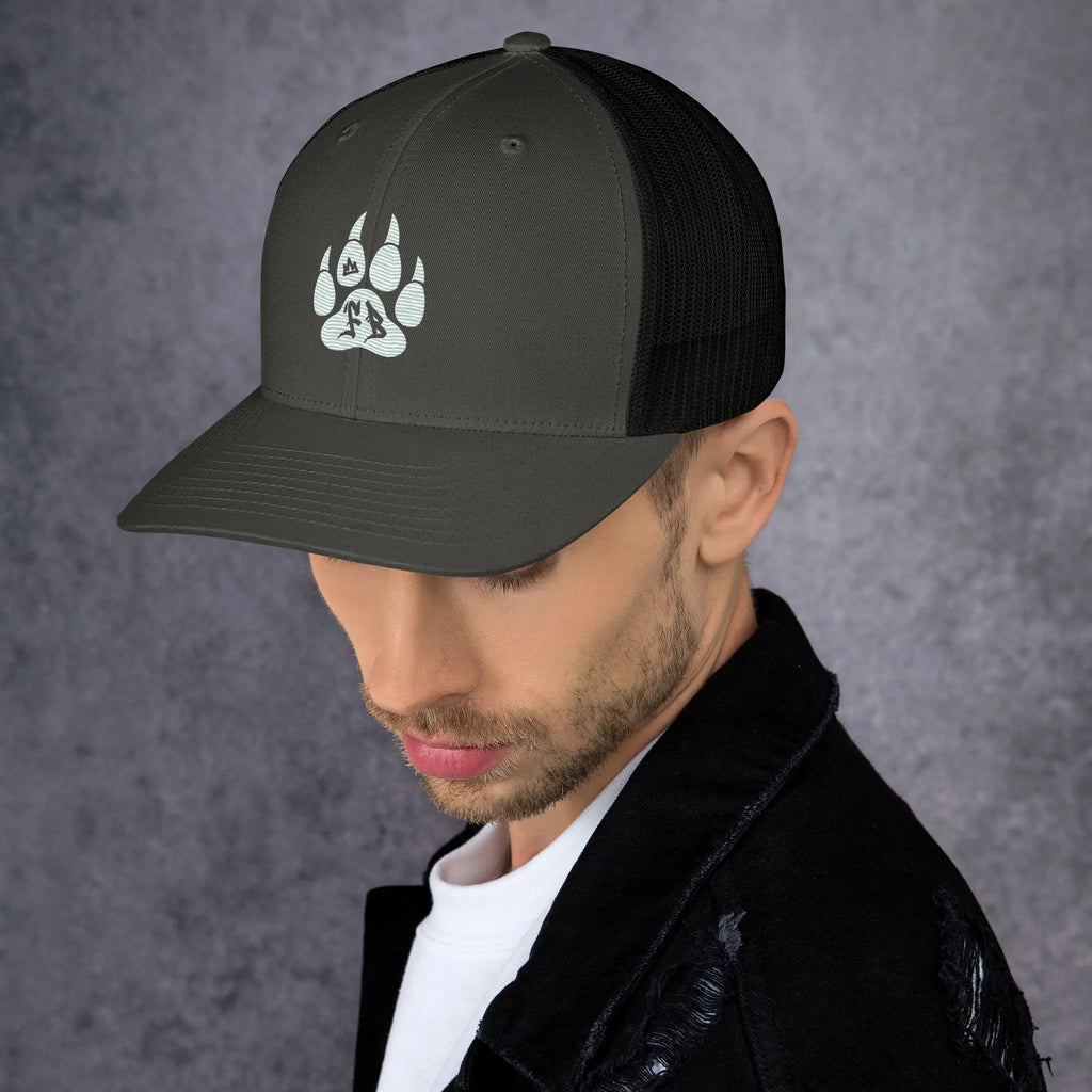 Stylish black trucker cap featuring a paw print design, perfect for outdoor enthusiasts.