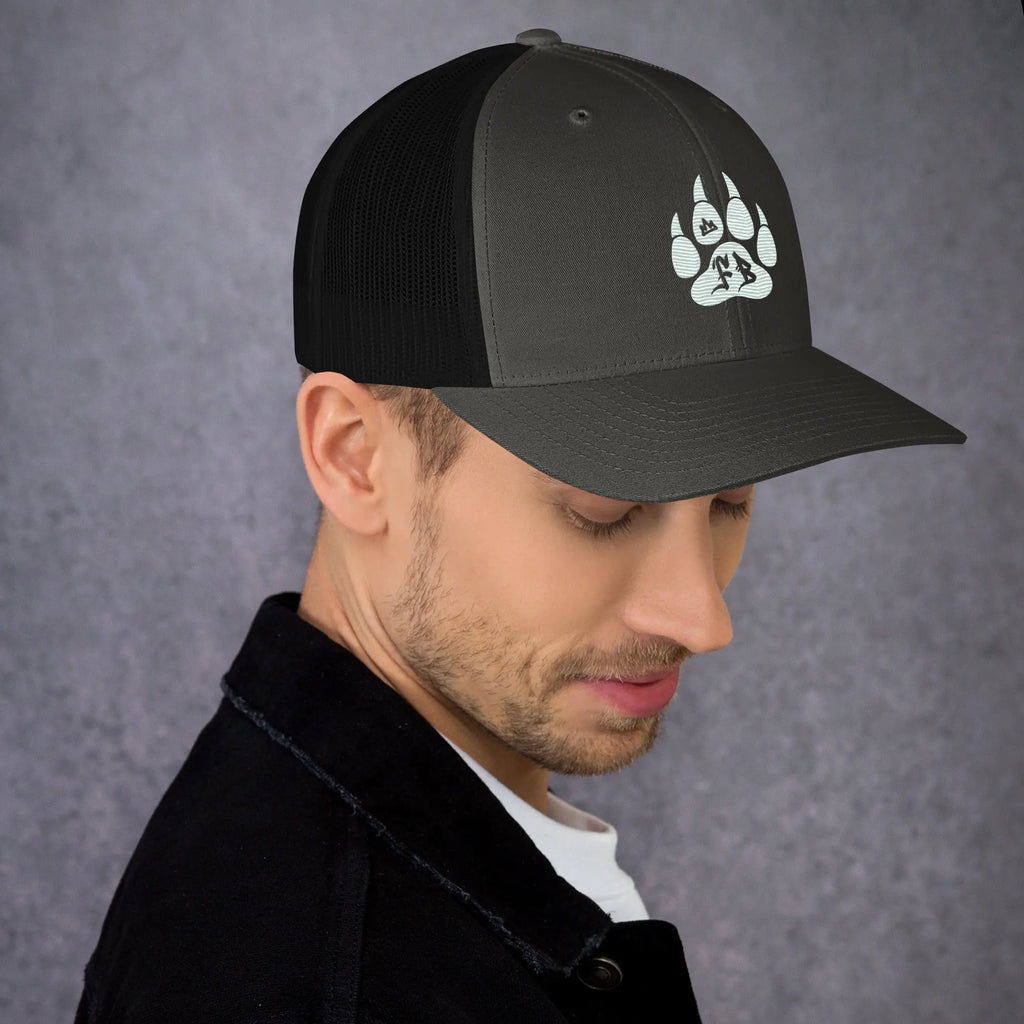 Men's black and gray trucker cap featuring a stylish paw print design, perfect for outdoor enthusiasts.