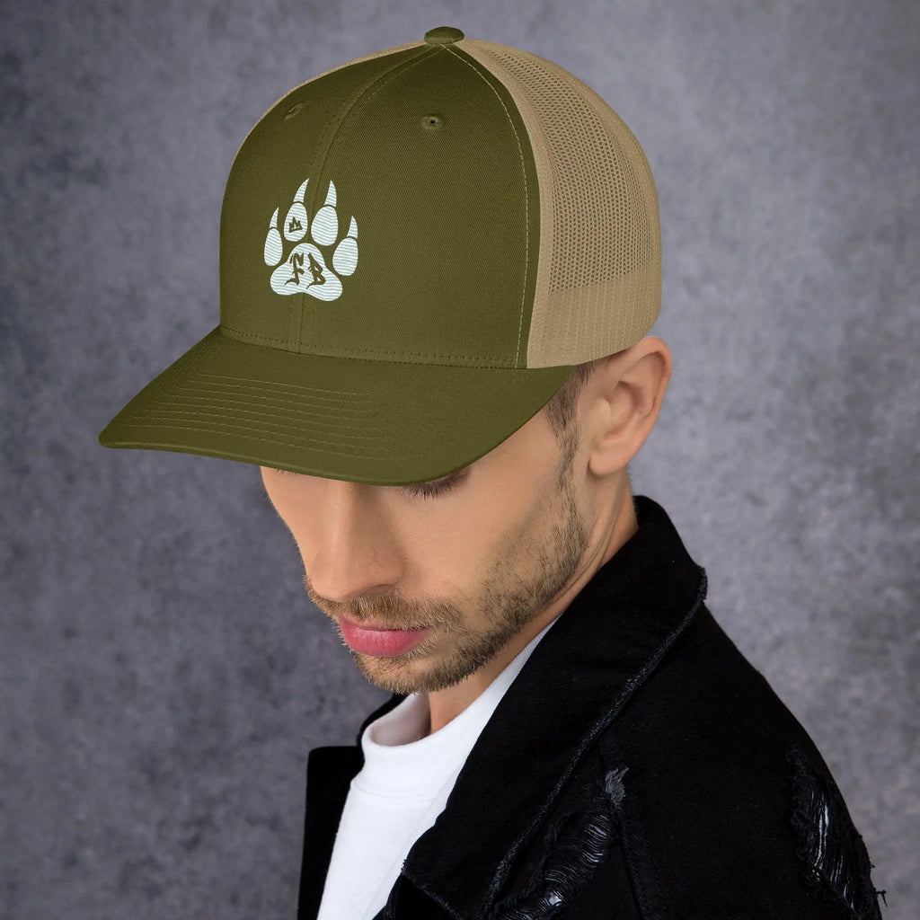 Olive green trucker hat with beige mesh, featuring a white animal paw print design.