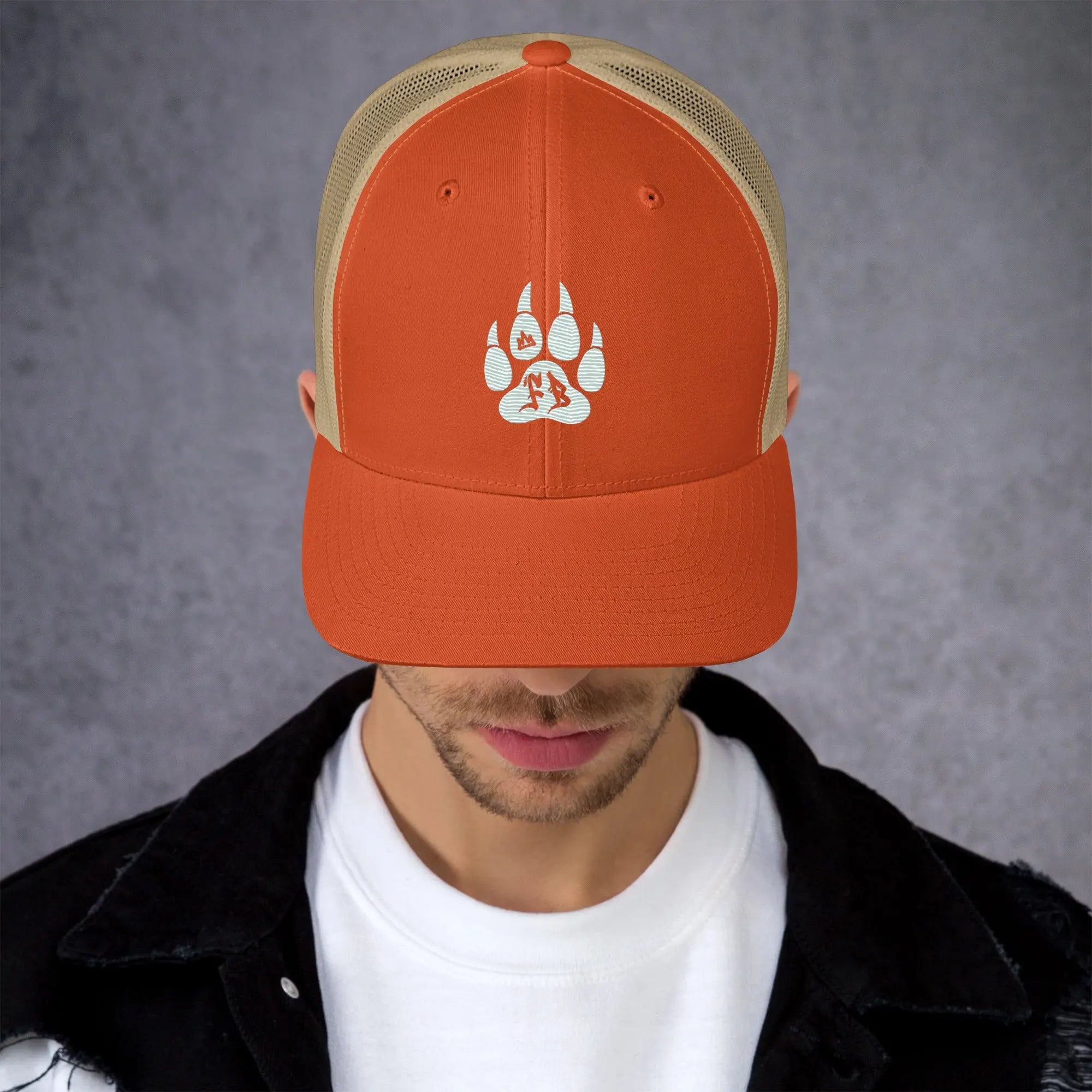 Orange mesh snapback cap with white paw print logo, perfect for outdoor adventures.