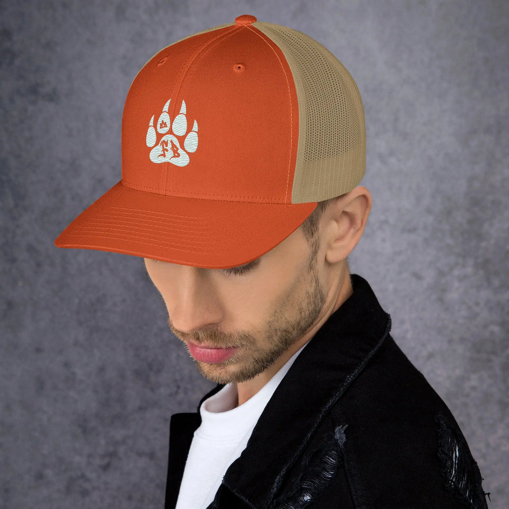 Men's orange snapback cap with mesh back and paw print design, perfect for outdoor adventures.