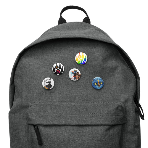 Gray backpack with colorful cartoon pins featuring playful designs and characters.